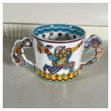 Gene Moore exclusively for Tiffany & Co., 1997, including a double handled cup and a plate (dia. 7-1