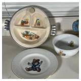 Wedgwood / Ralph Lauren Polo Bear plate, a Wedgwood Beatrix Potter Peter Rabbit plate, and a Bamboli