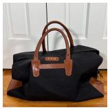 T. ANTHONY DUFFLE BAG | Black canvas bag with brown leather straps and full leather bottom, monogram