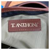 T. ANTHONY DUFFLE BAG | Black canvas with brown leather detailing, monogrammed D.M.B.; approx. 14 x 