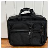  TUMI ROLLING BRIEFCASE | With many storage compartments, appearing in excellent condition; h. 14 x 