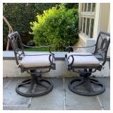 outdoor lounge chairs, cast aluminum, swivelling arm chairs with a little bit of spring to lounge ba