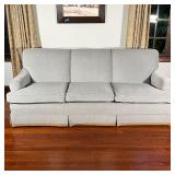 BLUE CHENILLE SOFA  | Three cushion couch with light blue chenille-type fabric upholstery and low-fo