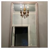 LARGE BEVELED MIRROR | Beveled glass wall mirror in a silvered frame; overall 48 x 28 in.