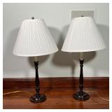 PAIR WOOD TABLE LAMPS | Turned wood candlesticks mounted as lamps; overall h. 28-1/4 x dia. 14-1/2 i