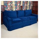 AVERY BOARDMAN PULLOUT COUCH | Three seater "sleeper sofa" with blue velvet upholstery, appearing in