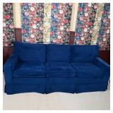 hree seater "sleeper sofa" with blue velvet upholstery, appearing in very good condition; h. 33 (ove