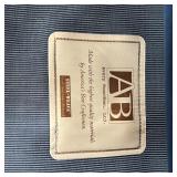 AVERY BOARDMAN PULLOUT COUCH | Three seater "sleeper sofa" with blue velvet upholstery, appearing in