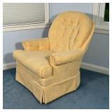 By Best Chairs Inc., with yellow soft textured upholstery, swivels and rocks; h. 40 x w. 33 x d. 31 