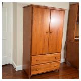 OAK WARDROBE CABINET | Made in USA, two cabinet doors over two drawers; h. 60 x w. 34 x d. 20 in.