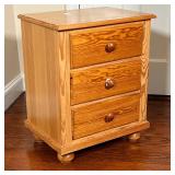 PINE SIDE TABLE | Bedside table / nightstand with three drawers; h. 20 x w. 23 x d. 15 in.