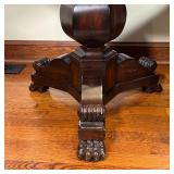 ROUND HALL TABLE | Round top on a carved wood tripod base with clawed feet; h. 30 x dia. 30 in.
