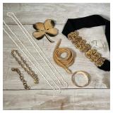 COSTUME JEWELRY | Including a snake-form necklace, a choker, gold-toned bracelets, a lucky four leaf
