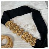 COSTUME JEWELRY | Including a snake-form necklace, a choker, gold-toned bracelets, a lucky four leaf