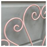 WROUGHT IRON BED FRAME | Pink scrollwork iron headboard; h. 41 x 39 in.