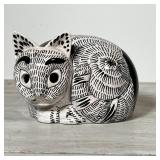 Including a paper mache weighted cat, an Italian faience cat, and a pair of floral decorated ceramic