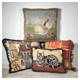 (4pc) NEEDLEPOINT PILLOWS | Various scenes, including a whale, a cat, and a townscape; largest 15 x 