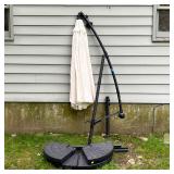 CANTILEVER LIGHTED UMBRELLA | With a solar panel attachment powering interior LED string lights, on 