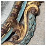  Carved, gilt, and polychrome framed oval wall mirror with Rococo decorations, h. 30 x 18 in.