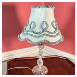 CRYSTAL GLASS TABLE LAMP | With a ruffled blue shade; base h. 13 x dia. 5 in.