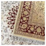 with central medallion on a beige ground, thick pile, appearing in overall very good condition; 9 ft