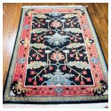 CONTEMPORARY CAUCASIAN RUG | Small area carpet with blue flowers within a red border; 6 ft. x 4 ft. 