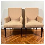A pair of contemporary style armchairs by Crate & Barrel with beige fabric upholstery; h. 37-1/4 x w