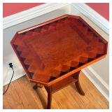 PARQUETRY SIDE TABLE | With inlaid contrasting wood, full gallery top over scrolled supports; h. 29 