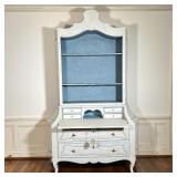 with a pagoda top over three open shelves, having a fall front desk over two full-width drawers with