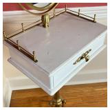 VANITY TABLE | Oval mirror over a 3/4 gallery surface with a single drawer, on a brass tripod base; 