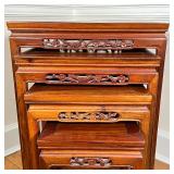 Carved wood nesting side tables with openwork branch borders decorated with carved bird and flowers;