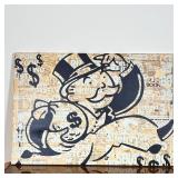 MONOPOLY CANVAS PRINT | Art print on canvas of the Monopoly man over news clippings - 18 x 26 in.