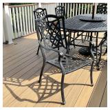 six matching armchairs (h. 37-1/4 x w. 24 x d. 24-1/2 in.), and a red umbrella with stand