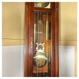  moon phase, with Arabic numerals, glass panel door with key; h. 82 x w. 21 x d. 12-1/2 in.