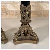 PAIR CANDLESTICK HOLDERS | Black enamel porcelain column on a shaped brass base with floral motif; h