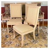 armchairs with textured floral upholstery (with a matching table runner) and four side chairs with t