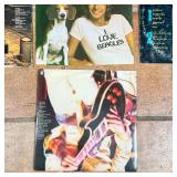 Barry Manilow, two Frampton albums, and two albums by the Steve Miller Band