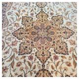 Having a central medallion on a cream field within brown floral borders - 10 ft. 4 in. x 7 ft. 9 in.