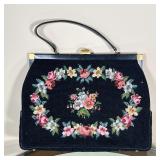 NEEDLEPOINT HANDBAG | Black hand back with needlepoint embroidery, labeled inside  "Switkes Handbags