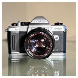 PROMASTER 2500PK SUPER | Manual focus 35mm SLR camera with a 50mm Promaster MC lens, with a leather 