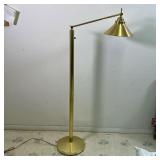 BRASS FLOOR LAMP | Floor / reading lamp, with an articulating arm on a reeded column base (dia. 11 i