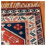 central medallion on a rust field within concentric borders with geometric devices - 5 ft. 5 in. x 3