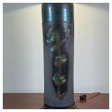 Japanese table lamp, of cylindrical form with green glazed characters, mounted on a wood base, with 