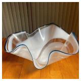 Milky free-form art glass bowl with a cobalt blue rim, signed "Susan Glass" and dated 