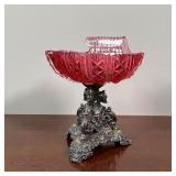 CRANBERRY GLASS VIDE POCHE ON STAND | Shell-form cut cranberry glass on a silver tripod base with fi
