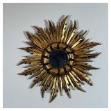 GILT SUNBURST WALL MIRROR | Central round mirror centered by feather form gilt painted carved wood s