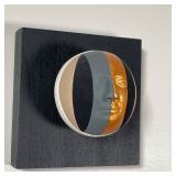 showing faces in contrasting colors and with gilding, mounted on square black-painted wood panels - 