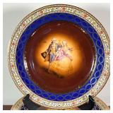 geometric borders and a cobalt border with wreathes, with gilt highlights, marked on the underside, 