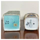 patterned turquoise design (no. 712 / 3259) and a smaller bud vase with overall brown glaze and blue