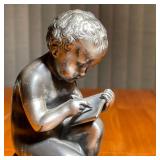 The Jennings Bros Manufacturing Company, weighted, in the form of putti scribes - h. 7 in.